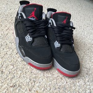 These are Air Jordan Bred 4’s, size 8.5